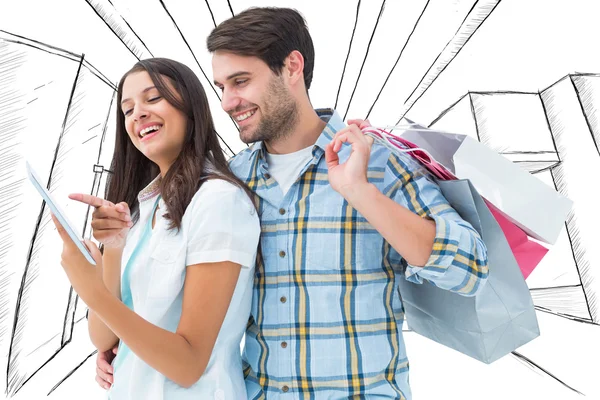 Casal feliz com sacos de compras — Fotografia de Stock