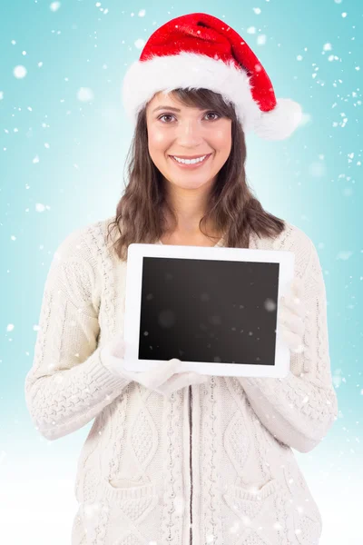 Feestelijke brunette houdt van tablet pc — Stockfoto