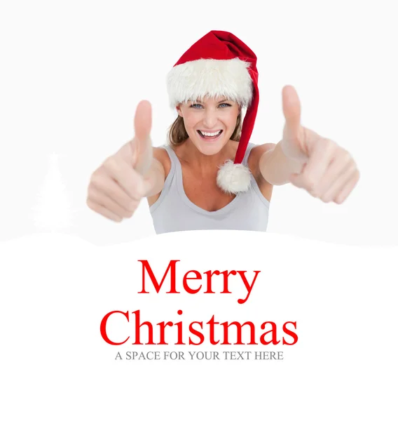 Donna con i pollici in su e cappello di Natale — Foto Stock
