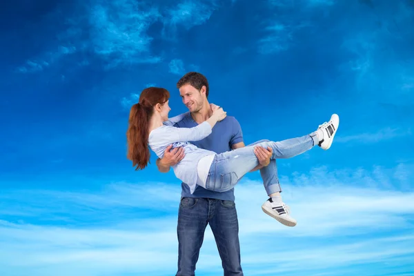 Man lifting up his girlfriend — Stock Photo, Image