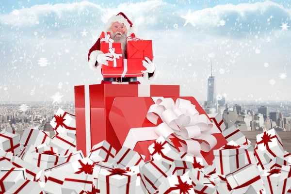 Santa standing in large gift — Stock Photo, Image