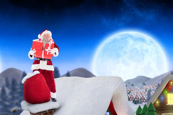 Santa op huisje dak — Stockfoto