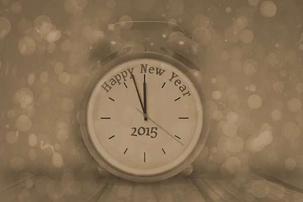 Composite image of happy new year in red alarm clock — Stock Photo, Image