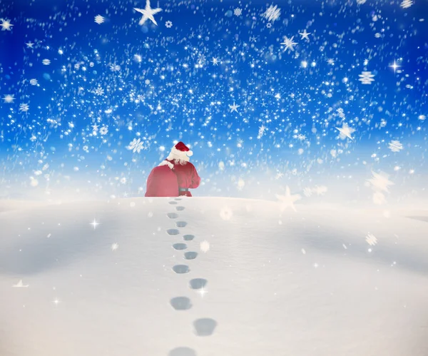 Santa walking in the snow — Stock Photo, Image