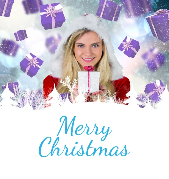 Mooi meisje in santa outfit houden geschenk — Stockfoto