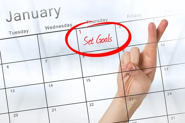 New years resolution against calendar — Stock Photo, Image