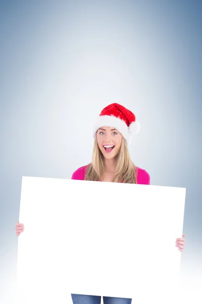 Festive blonde holding large poster — Stock Photo, Image