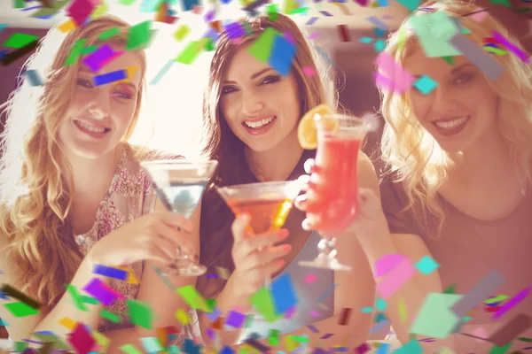 Attractive friends drinking cocktails — Stock Photo, Image