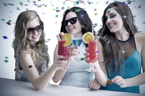 Composite image of friends drinking cocktails — Stock Photo, Image