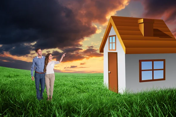 Couple looking away against green field — Stock Photo, Image