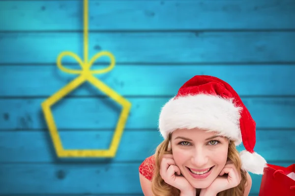 Smiling woman lying between sale shopping bag — Stock Photo, Image