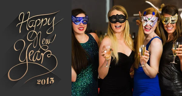 Friends wearing masks holding champagne — Stock Photo, Image