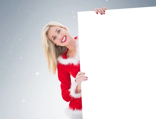 Festive blonde showing white card — Stock Photo, Image
