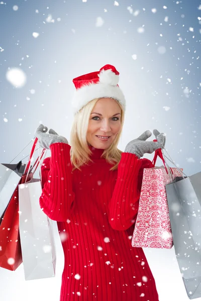 Rubia festiva con bolsas de compras — Foto de Stock