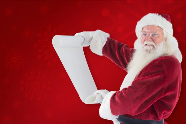 Father Christmas holds list — Stock Photo, Image