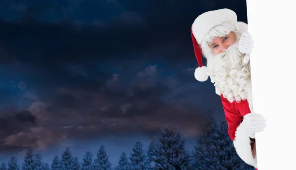 Happy santa claus holding poster — Stock Photo, Image