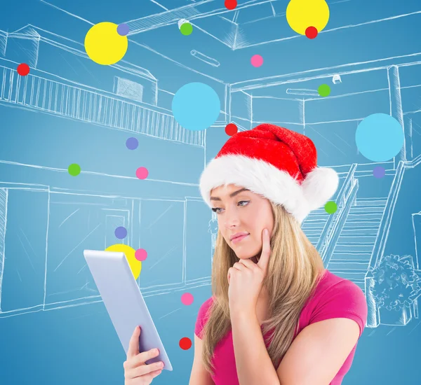 Festive blonde looking at tablet pc — Stock Photo, Image