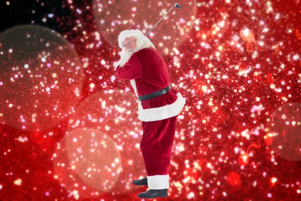 Santa Claus swings his golf club — Stock Photo, Image