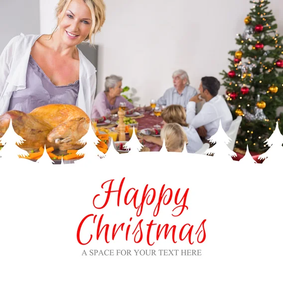 Proud mother showing roast turkey — Stock Photo, Image