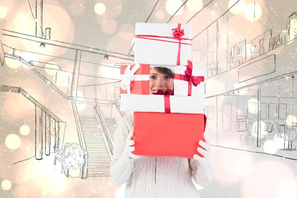 Woman holding pile of gifts — Stock Photo, Image