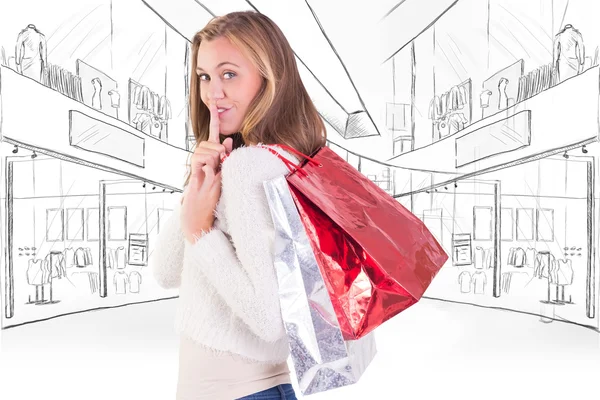 Blonde keeping a secret holding bags — Stock Photo, Image