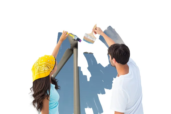 Young couple painting a sky — Stock Photo, Image