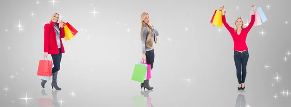 Composite image of happy blonde holding shopping bags — Stock Photo, Image