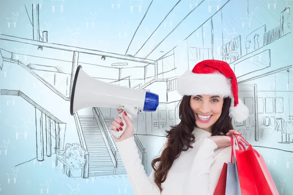 Sonriente morena sosteniendo bolsas de regalo y megáfono —  Fotos de Stock