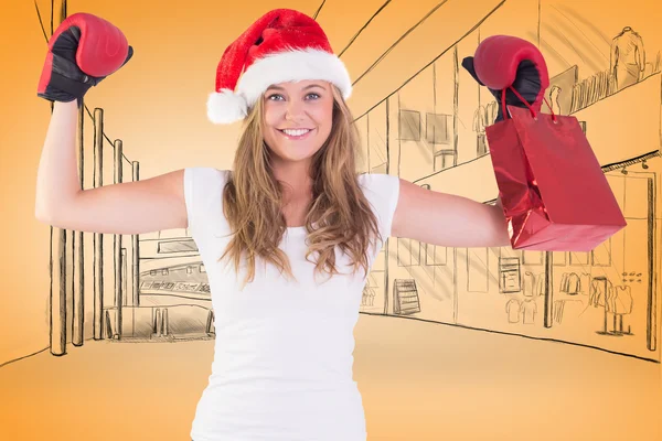 Blonde with boxing gloves and shopping bag — Stock Photo, Image