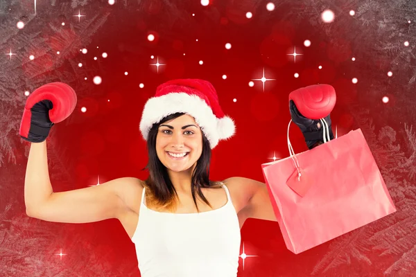 Brunette in handschoenen houden shopping tassen — Stockfoto