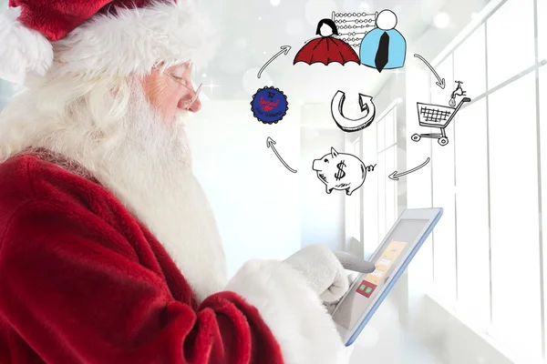 Santa uses a tablet pc — Stock Photo, Image