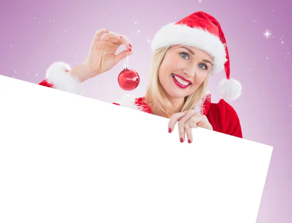 Festive blonde showing white card — Stock Photo, Image