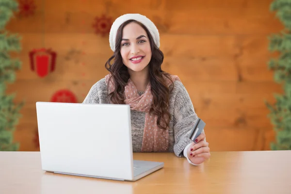 Composite image of woman with credit card — Stock Photo, Image