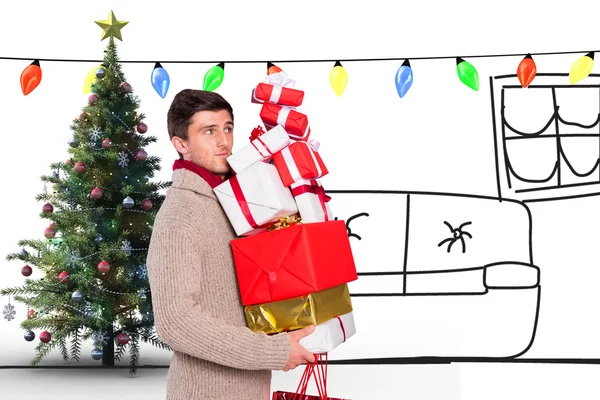 Homme avec de nombreux cadeaux de Noël — Photo