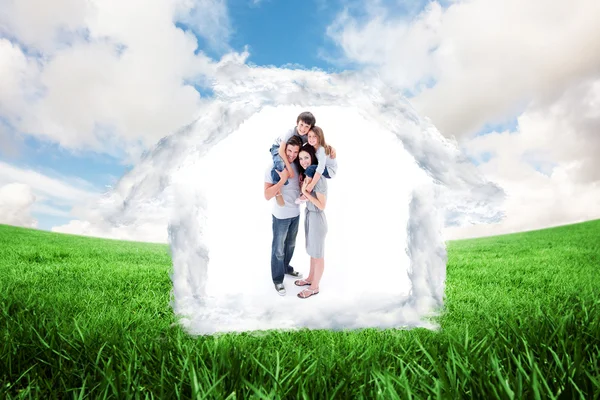 Cheerful parents giving their children piggyback — Stock Photo, Image