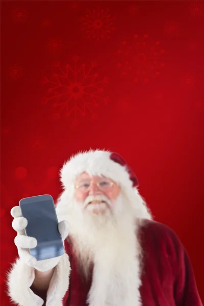 Άγιος Βασίλης δείχνει ένα smartphone — Φωτογραφία Αρχείου
