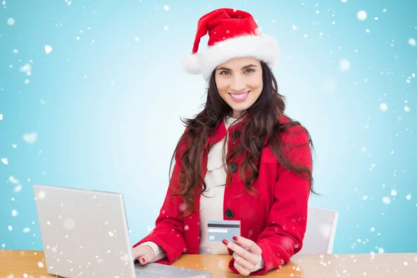 Festive brunette shopping online — Stock Photo, Image