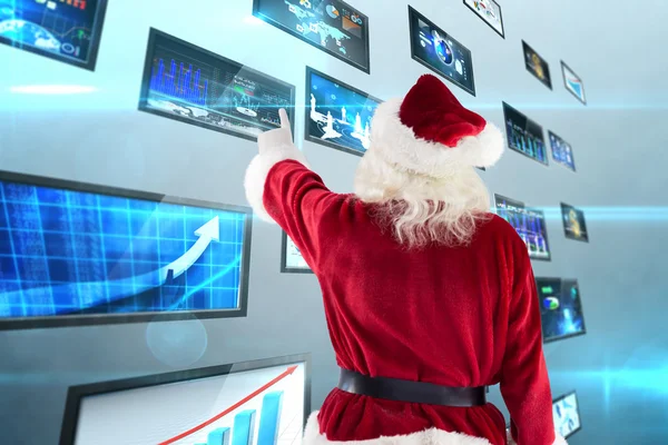 Santa Claus poäng på något — Stockfoto