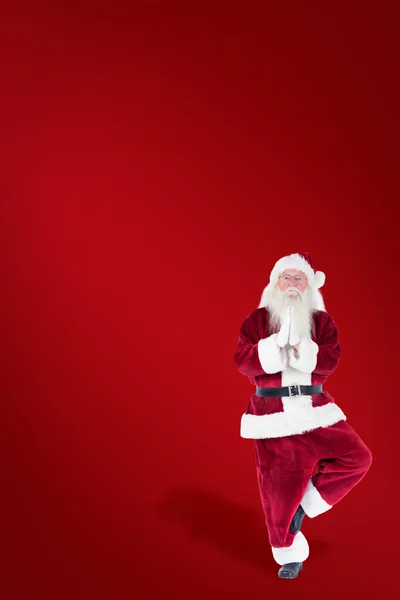 Father Christmas doing some yoga — Stock Photo, Image