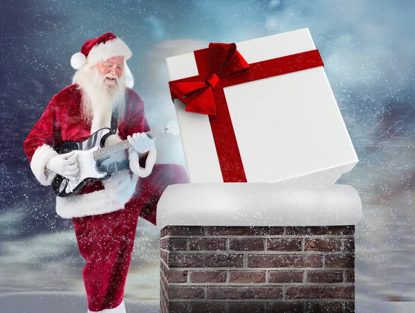 Papai Noel se diverte com guitarra — Fotografia de Stock