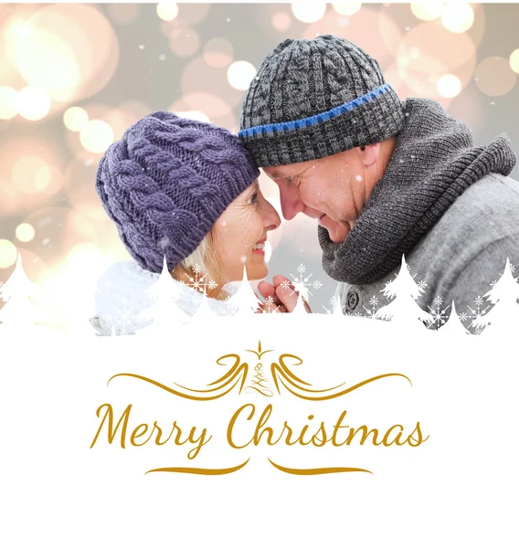 Composite image of mature winter couple — Stock Photo, Image