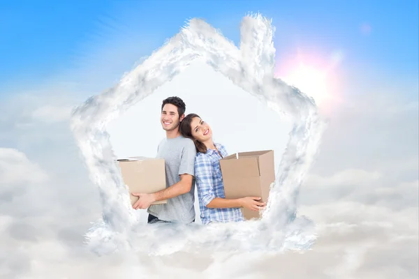 Wife and husband carrying boxes in their new — Stock Photo, Image