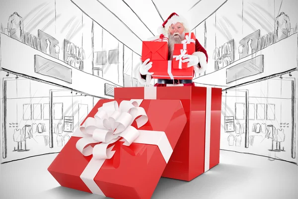 Santa standing in large gift — Stock Photo, Image