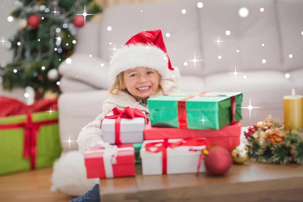 Girl surrounded by christmas gifts — Stock Photo, Image