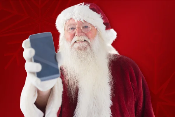 Santa Claus pokazuje smartphone — Zdjęcie stockowe