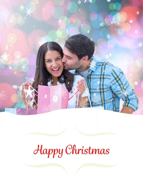 Zusammengesetztes Bild eines glücklichen Paares mit Einkaufstüten — Stockfoto