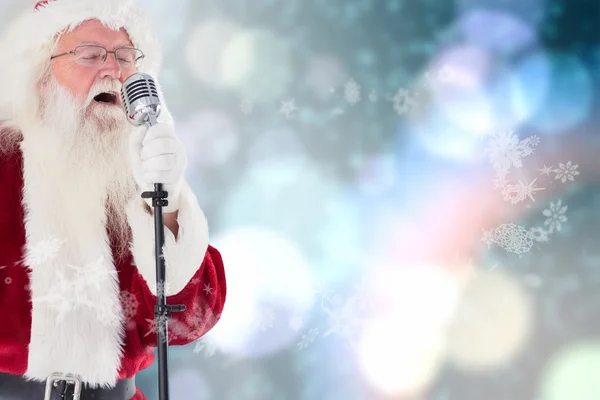 Santa Claus is singing Christmas songs — Stock Photo, Image