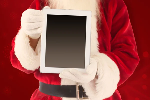 Weihnachtsmann zeigt Tablet-PC — Stockfoto