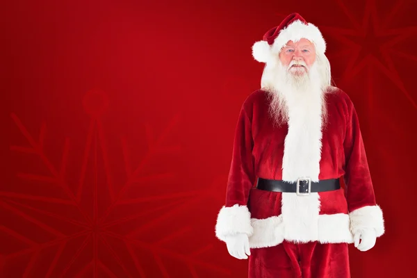 Jolly santa smiling at camera — Stock Photo, Image