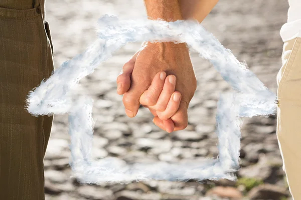 Happy senior couple holding hands — Stock Photo, Image